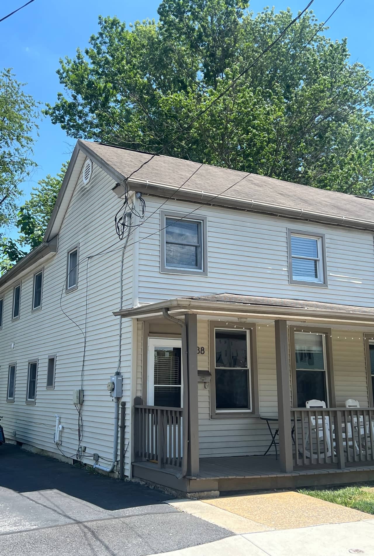 Front and side exterior of 38 Choate Street with its covered entry.